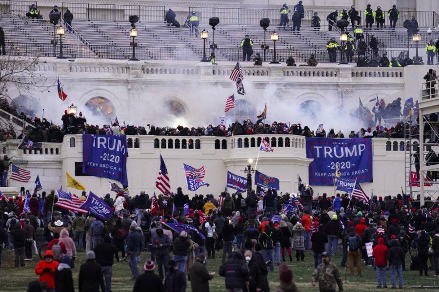 Trump supporters storm the Capitol in attempt to create change. (Source: John Minchillo) 