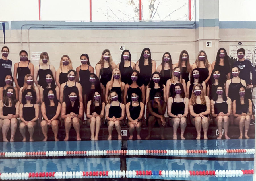 The+Girls+Swim+team+poses+for+a+picture.