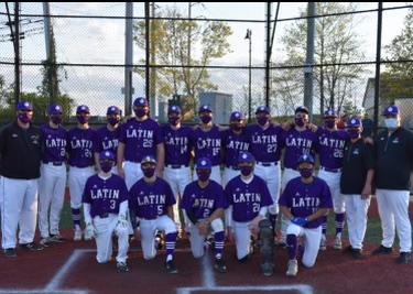 Head varsity coach Brian Mylett poses with his team after they come off their first big win. (Source: Patrick O'Connor)