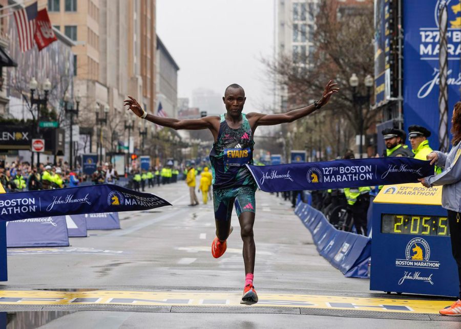 Evans Chebet crosses the finish line and wins the Boston Marathon. (Source: Winslow Townson)