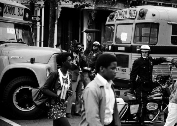 School buses shuttle Black students during the 1974 busing crisis. (Source: Spencer Grant)