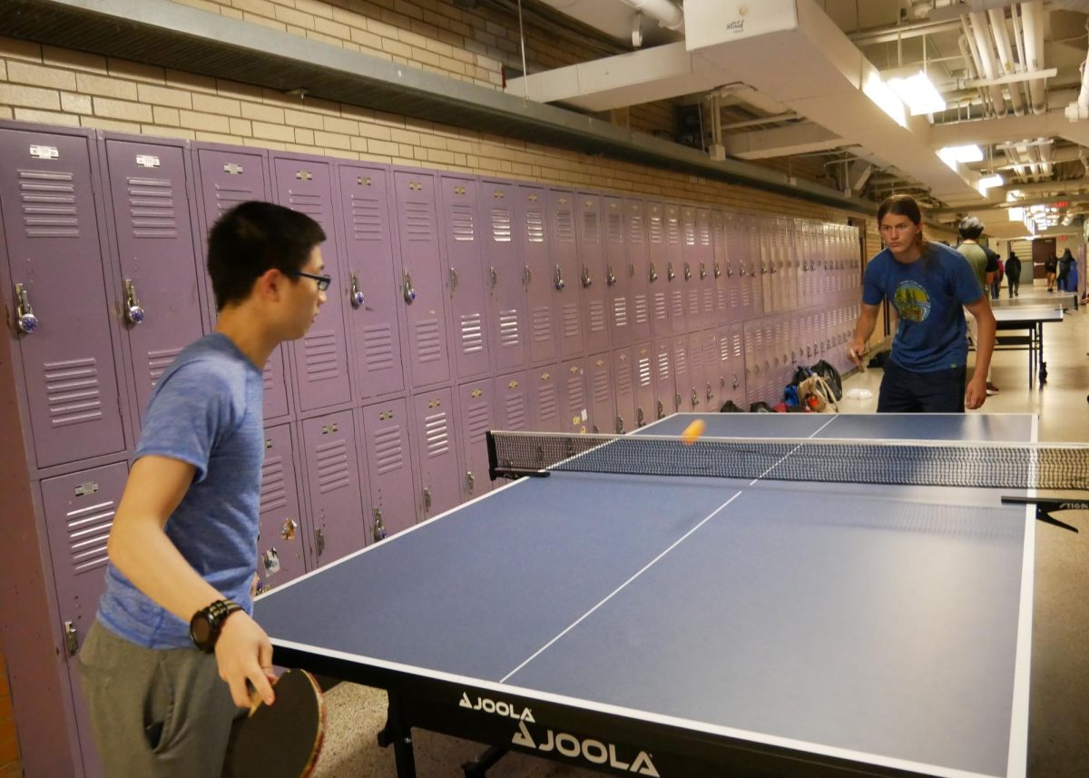 Table tennis players battle it out in the basement hallway. (Source: Lauren Dong (IV))