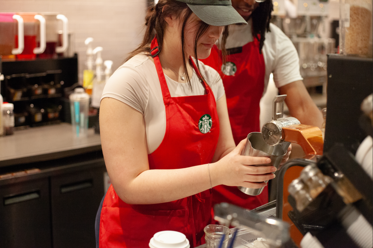 Jacey Thai (II) works at her tipped barista job. (Source: Alex Le (II))