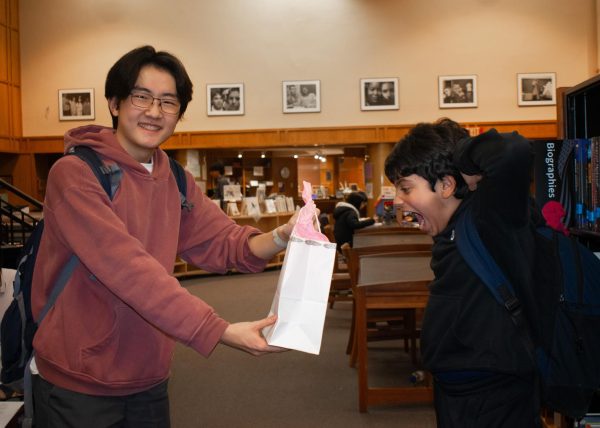 Jacob Shi (II) shocks Kanav Vashishth (V) with his Secret Santa gift! (Source: Meilin Sha (IV))