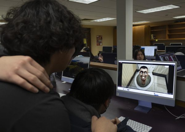 Students watch the viral Skibidi Toilet series. (Source: Weian Xue (III))