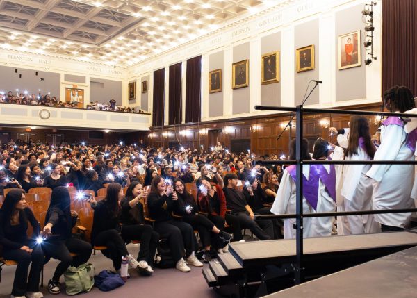 Students from Class I and II “light it up” with their phone flashlights! (Source: Lauren Dong (III)