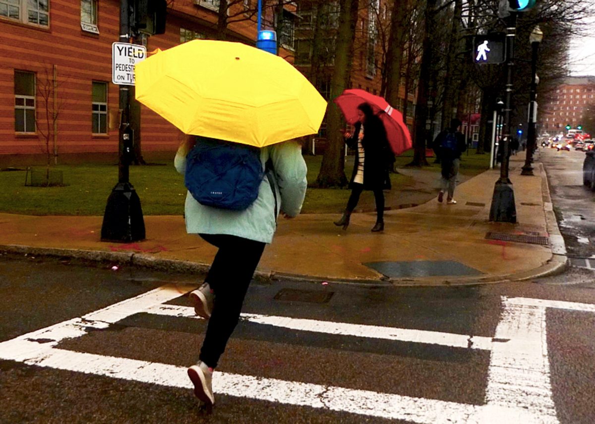 BLS student shows appreciation for the rain, skipping on the way to Ruggles! (Source: Isabella Endozo (III))