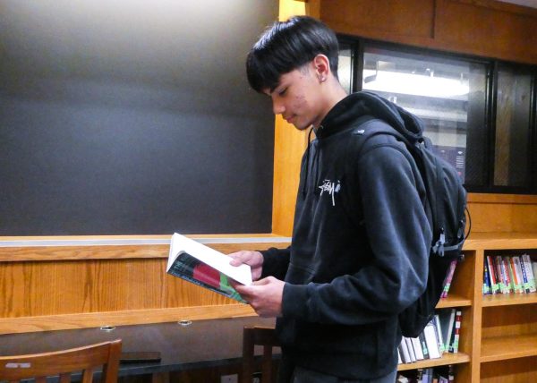 Damani Hong (II) is spotted wearing his Stussy hoodie in the library. (Source: Isabella Endozo (II))