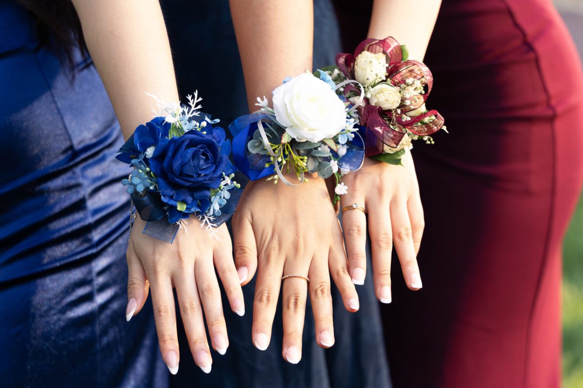 Junior Prom attendees show off their corsages. (Source: Lauren Dong (II))
