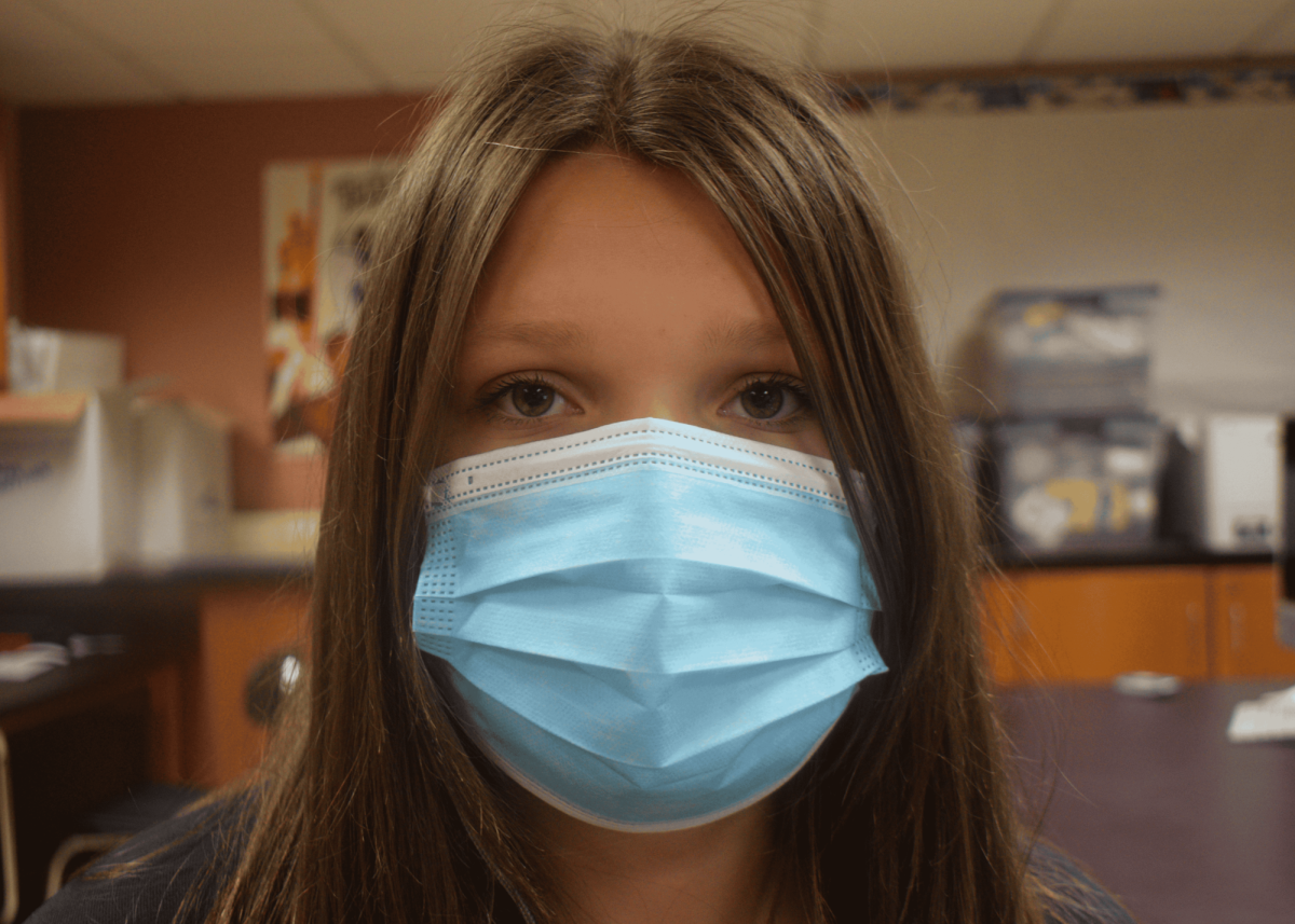 Sophia Krohn (IV) wears a mask for protection against hantavirus. (Source: Julianne Jang (III))